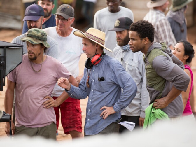 Nnamdi Asomugha (L) with Cary Fukunaga (R) and crew on the set of "Beasts of No Nation"