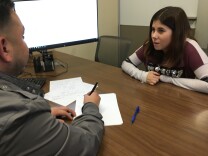 Destiney Rodriguez, right, reviews her academic schedule with Mt. San Antonio College counselor Jesse Lopez.
