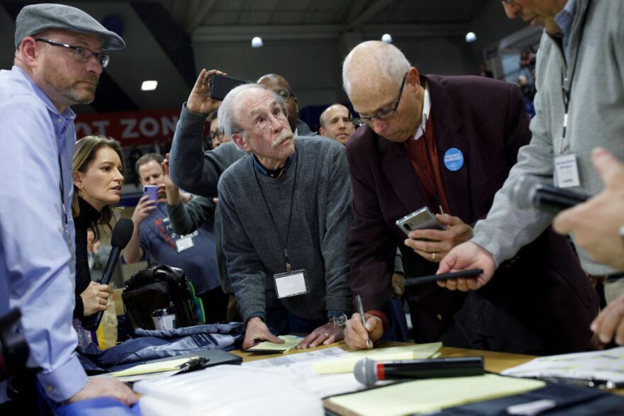 DES MOINES, IA - FEBRUARY 03: Officials from the 68th caucus precinct overlook the results of the first referendum count during a caucus event on February 3, 2020 at Drake University in Des Moines, Iowa, United States. Iowa is the first contest in the 2020 presidential nominating process with the candidates then moving on to New Hampshire. (Photo by Tom Brenner/Getty Images)