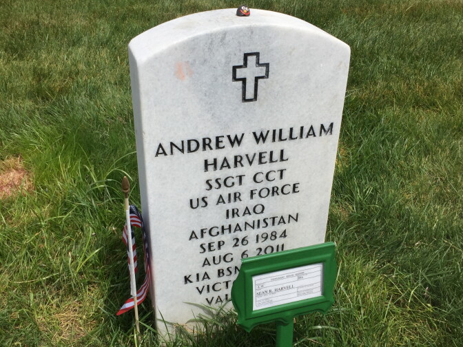 A headstone in Section 89A marks the grave of Staff Sergeant Andrew Harvell. A temporary marker notes that his brother, Sean Harvell, is buried there as well.