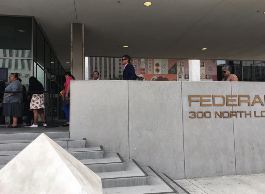 People line up outside the federal building on Los Angeles Street in downtown L.A., where U.S. immigration officials have offices.