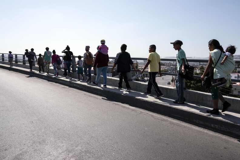 Central American migrants traveling in the "Migrant Via Crucis" walk to their legal counseling session in Tijuana, Mexico for breakfast and legal counseling on April 27, 2018.