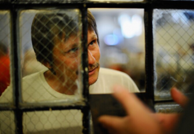  An inmate at Chino State Prison speaks to a parole officer in the overcrowded dayroom of Sycamore Hall that was modified to house prisoners on December 10, 2010 in Chino, California. 