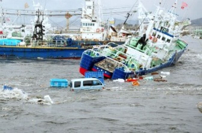 JAPAN OUTFishing boats and vehicles are carried by a tsunami wave at Onahama port in Iwaki city, in Fukushima prefecture, northern Japan on March 11, 2011.