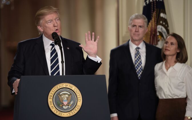 Judge Neil Gorsuch (C) and his wife Marie Louise look on, after President Donald Trump nominated him for the Supreme Court, at the White House in Washington, D.C., on Jan. 31, 2017.
President Donald Trump nominated federal appellate judge Neil Gorsuch as his Supreme Court nominee, tilting the balance of the court back in the conservatives' favor.