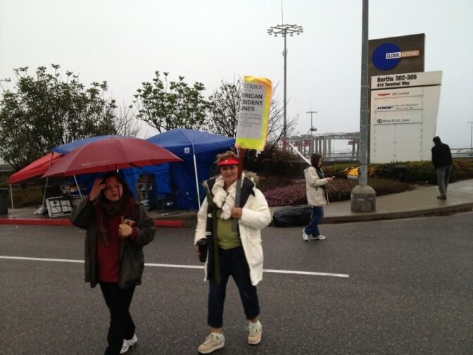 Picketing continues for a fourth day outside the terminals at the Ports of Long Beach and Los Angeles.