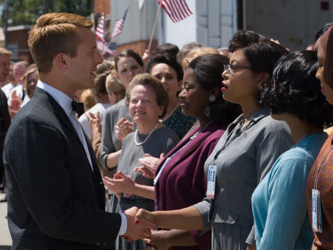 Katherine G. Johnson (Taraji P. Henson), flanked by fellow mathematicians Dorothy Vaughan (Octavia Spencer) and Mary Jackson (Janelle Monáe), meet the man they helped send into orbit, John Glenn (Glen Powell), in "Hidden Figures."