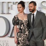 US actress Dakota Johnson (L) and Northern Irish actor Jamie Dornan (R) pose on the red carpet upon arrival at the UK premiere of Fifty Shades Darker in London on February 9, 2017. / AFP / Justin TALLIS        (Photo credit should read JUSTIN TALLIS/AFP/Getty Images)