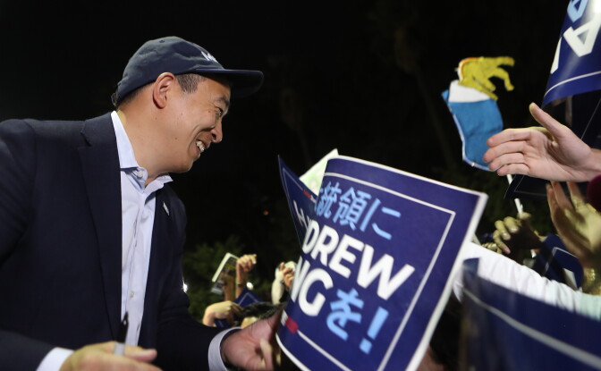 LOS ANGELES, CALIFORNIA - SEPTEMBER 30: Democratic presidential candidate and entrepreneur Andrew Yang (L) greets supporters at a campaign rally on September 30, 2019 in Los Angeles, California. Yang is the son of Taiwanese immigrants and was born in upstate New York.  (Photo by Mario Tama/Getty Images)