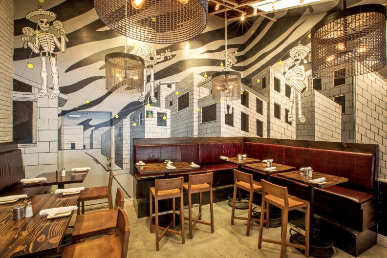 A mural by Carlos Nieto inside Mercado Restaurant uses two walls to create a "3D" effect for diners. 