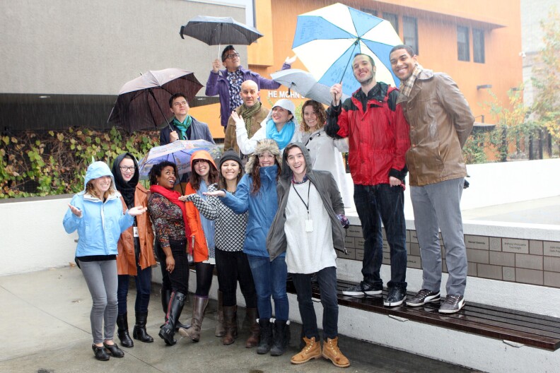 KPCC staffers outside the Mohn Broadcast Center, decked out to face one of the first El Niño storms of the season.