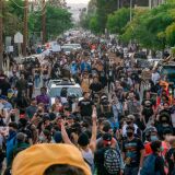 Protesters march through Hollywood after curfew during a demonstration over the death of George Floyd while in Minneapolis Police custody, in Los Angeles, California, June 2, 2020. - Anti-racism protests have put several US cities under curfew to suppress rioting, following the death of George Floyd in police custody. (Photo by Kyle Grillot / AFP) (Photo by KYLE GRILLOT/AFP via Getty Images)