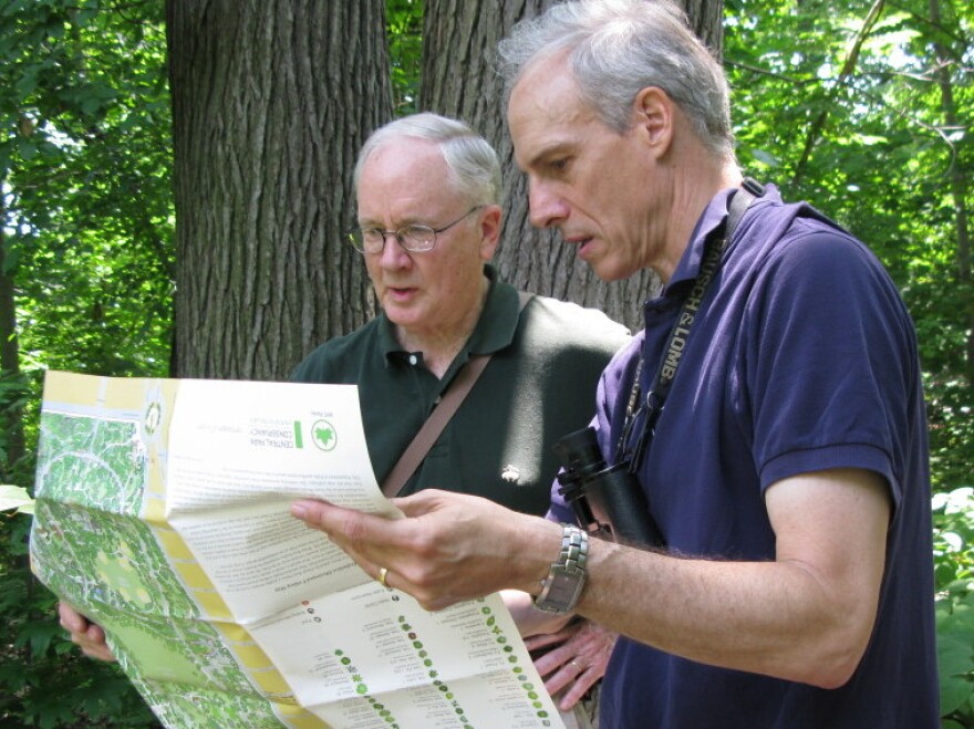 Edward Barnard (left) and Ken Chaya look at their map of Central Park as they stand in its North Woods.