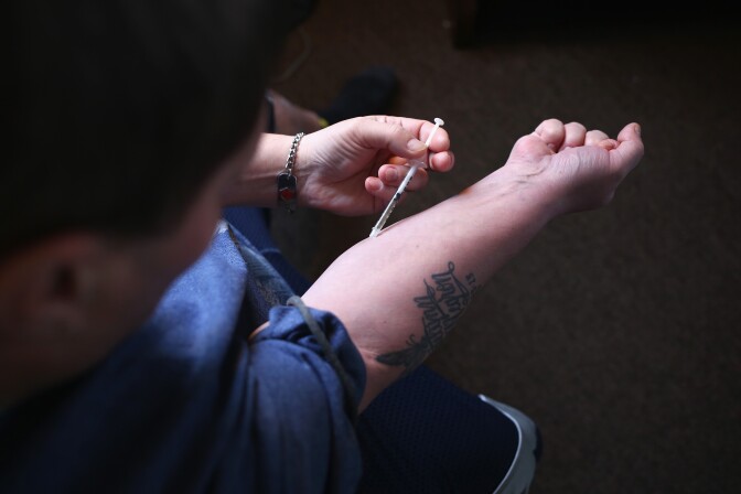 NEW LONDON, CT - MARCH 23:  A heroin user injects himself on March 23, 2016 in New London, CT. Communities nationwide are struggling with the unprecidented heroin and opioid pain pill epidemic. On March 15, the U.S. Centers for Disease Control (CDC), announced guidelines for doctors to reduce the amount of opioid painkillers prescribed nationwide, in an effort to curb the epidemic. The CDC estimates that most new heroin addicts first became hooked on prescription pain medication before graduating to heroin, which is stronger and cheaper.  (Photo by John Moore/Getty Images)