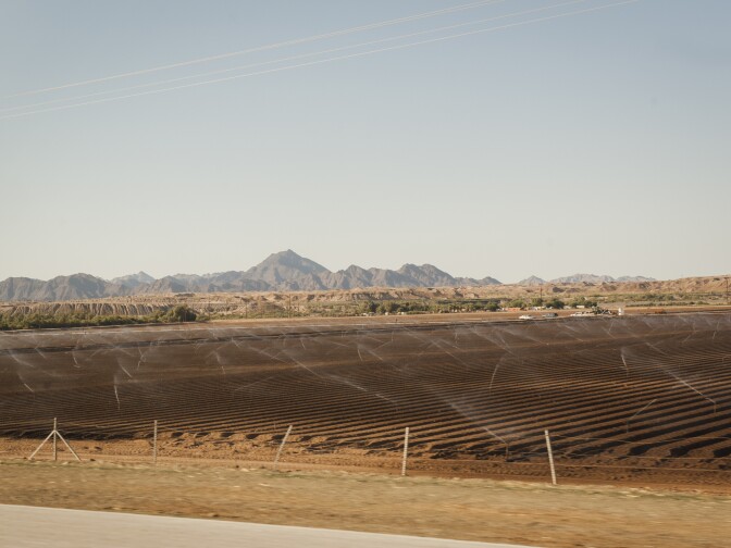 Sprinklers irrigate agricultural land on the Fort Yuma Indian Reservation, which is dominated by farmland. The Quechan Tribe is using a new tax credit program to fund construction of a 42-unit affordable housing project.  