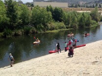 Kayakers on the L.A. River near Marsh Park during the opening day of the new "recreation zone."