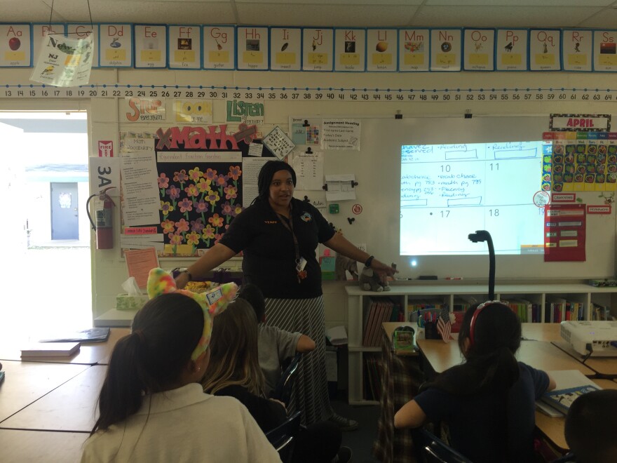 Magnolia Science Academy 7 third grade teacher Jennifer Rivera reminds students of the upcoming talent show before dismissing her class for the day.