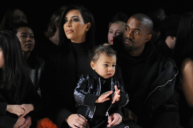 NEW YORK, NY - FEBRUARY 14:  (L-R) Kim Kardashian, North West and Kanye West attend the Alexander Wang Fashion Show during Mercedes-Benz Fashion Week Fall 2015 at Pier 94 on February 14, 2015 in New York City.  (Photo by Craig Barritt/Getty Images)