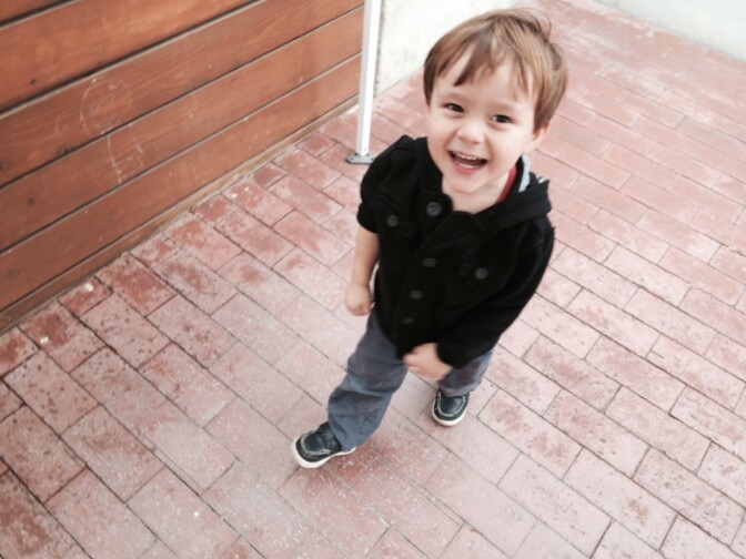 Fernando Patlan jumped off his trike and raced to grab balls in the basketball area of Mother's Club preschool in Pasadena. He is 2 years-old and in 2016 he will be the right age for LAUP programming, but it is not clear that LAUP will have money to keep funding the 11,000 preschool seats it funds this year. 