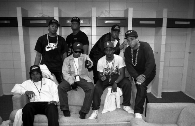 File: Rappers N.W.A. (back) Dr. Dre, Laylaw from Above The Law, The D.O.C. (front) Ice Cube, Eazy-E., MC Ren and DJ Yella  pose for a photo before their performance during the "Straight Outta Compton" tour at Kemper Arena in Kansas City, Missouri in 1989.  