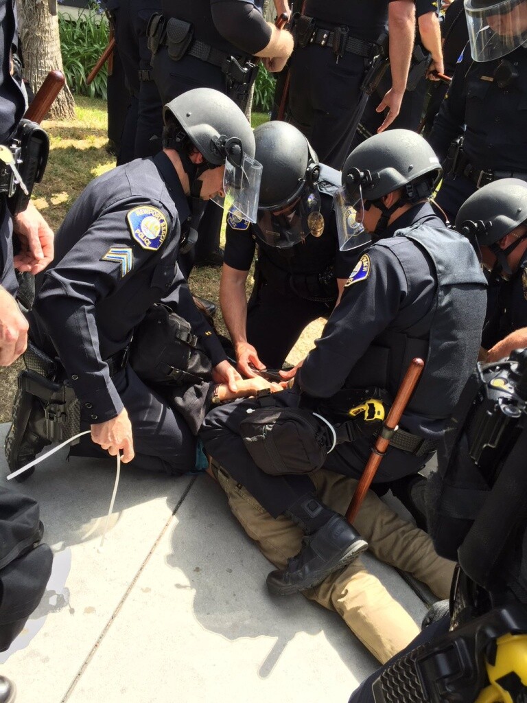 Police make an arrest following the Donald Trump rally in Anaheim.