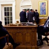 U.S. President Barack Obama talks on the phone with President Hosni Mubarak of Egypt as Vice President Joe Biden and the President's National Security team listen in the background in the Oval Office January 28, 2011 in Washington, DC.