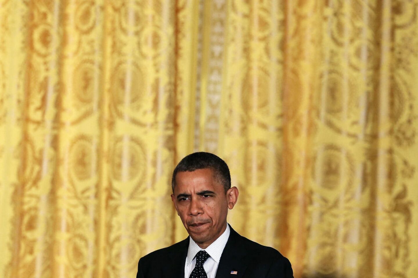 U.S. President Barack Obama walks into the East Room to speak to the media at the White House, on November 9, 2012 in Washington, DC. President Obama said he invited Congressional Republican leaders to come to the White House to discuss ways of the avoiding the so-called fiscal cliff at the end of the year.   