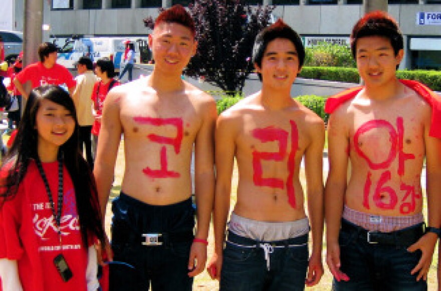 From left to right, Paula Shin, Raymond Yoo, Benny Kimm, Kevin Choi and Shawn Choi are red and ready to cheer on their team. 
