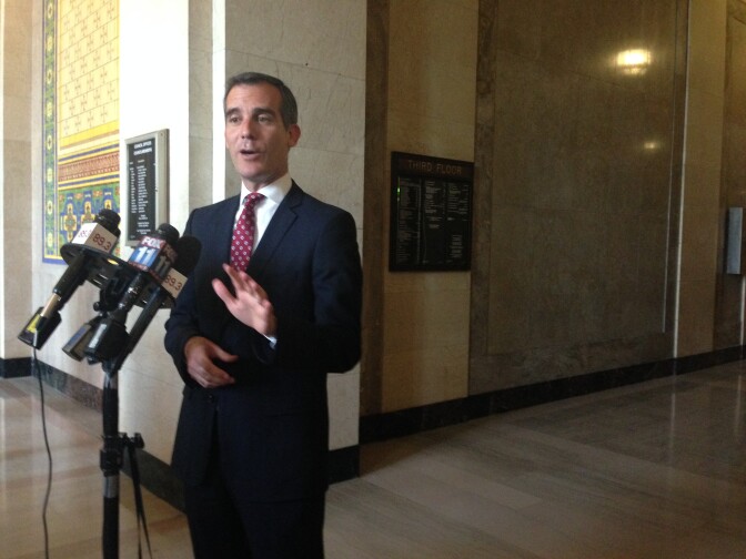 Mayor Eric Garcetti answers the media's questions outside Council Chamber. 