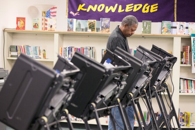 FERGUSON, MO - NOVEMBER 04:  William Banks casts his vote at a polling place on November 4, 2014 near Ferguson, Missouri.  In last April’s election only 1,484 of Ferguson's 12,096 registered voters cast ballots. Community leaders are hoping for a much higher turnout for this election. Following riots sparked by the August 9 shooting death of Michael Brown by Darren Wilson, a Ferguson police officer, residents of this majority black community on the outskirts of St. Louis have re-examined race relations in the region and hope to take a more active role in the region's politics. Two-thirds of Ferguson’s population is African American, but five of its six city council members are white, as is its mayor, six of seven school board members and 50 of its 53 police officers.  (Photo by Scott Olson/Getty Images)