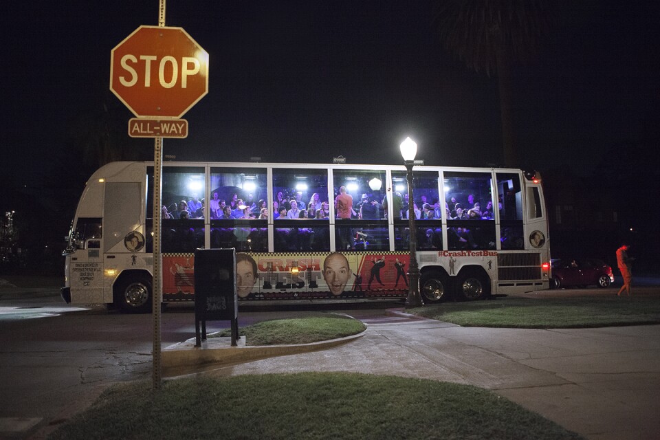The "Crash Test" tour bus features a glass wall and a stereo system which allows hosts Paul Scheer and Rob Huebel to talk with people on the street from the inside.