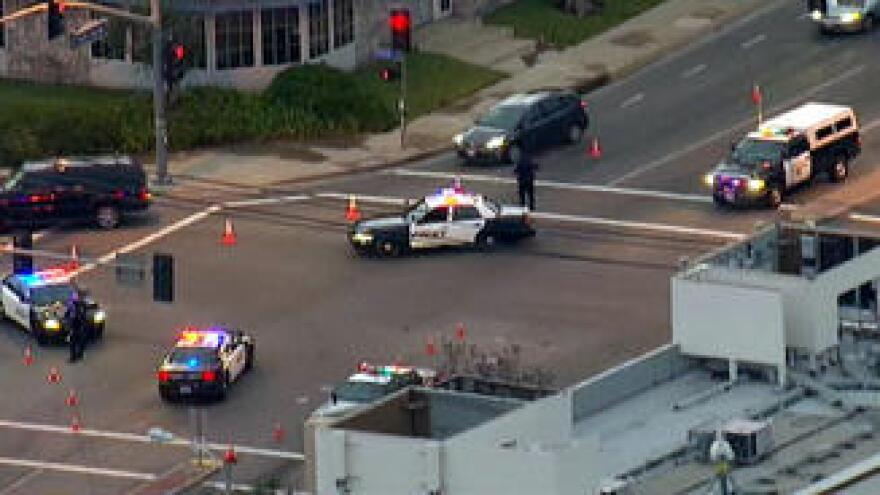 Police vehicles block an intersection where a shooting occurred in Tustin, according to NBC LA. It is one of several locations where shootings were reported early Tuesday morning.
