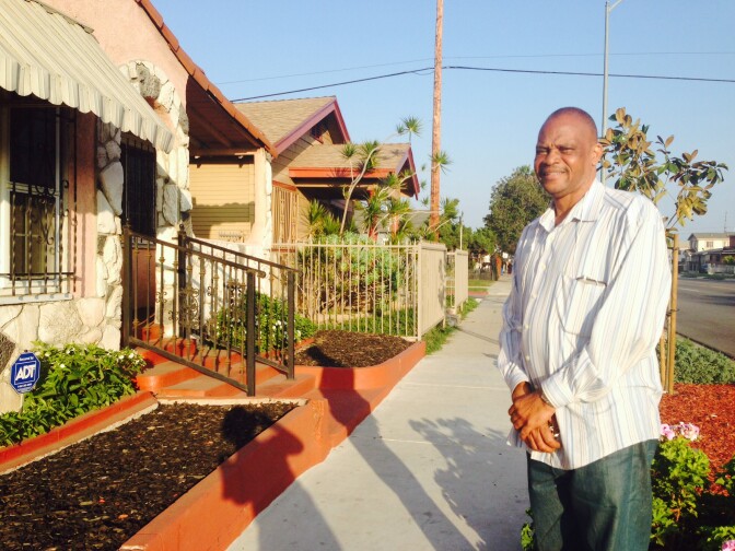 Benjamin Provo in front of his mother's house on Century Avenue. Her sidewalk was so broken, she was unable to leave through the front door, but Councilman Bernard Parks used discretionary money from his office to cut down a tree and replace the broken sidewalk slabs.