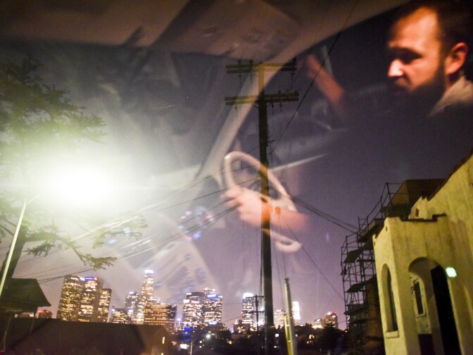 NPS Ecologist Justin Brown stopped on a hill top near downtown Los Angels listening for signals from radio-collared coyotes late Wednesday night, June 3rd. 


National Park Service Ecologist Justin Brown tracks coyotes living near downtown Los Angeles late Wednesday night June 3 and early Thursday morning June 4, 2015, in Los Angeles, CA. Some of the coyotes are fitted with radio collars.