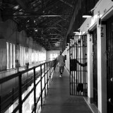 SAN QUENTIN, CA - JUNE 08:  Branden Terrel walks down the hallway near his cell on June 8, 2017 in San Quentin, California.  Branden Terrel was sentenced to 11 years in state prison for the 2012 stabbing death of one of his friends. In an agreement between the prosecution and defendant, Terrel pleaded guilty to voluntary manslaughter. When sentenced, Terrel requested to spend his time behind bars at San Quentin State Prison. He did so because of all of the programs that San Quentin offers to its prisoners. The programs range from carpentry classes, to drama groups, to computer coding and also athletic programs such as baseball.

Prisoners at San Quentin State Prison have been playing baseball since the 1920s. Starting in 1994, the inmates started playing against players from outside the prison. San Quentin now has two baseball teams, the San Quentin Athletics and the San Quentin Giants. 

The baseball program is run by Elliot Smith. He spends two days at San Quentin each week helping to coach both of the teams at practice and during games. The program is open to all prisoners, except for those on death row, in solitary confinement and in protective custody. Smith brings in teams from all over the country to play after the San Quentin teams.  (Photo by Ezra Shaw/Getty Images)