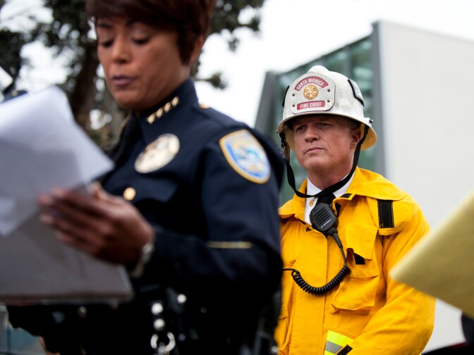 Scott Ferguson of the Santa Monica Fire Department prepares to speak to the media during a press conference about the house fire on Yorkshire.