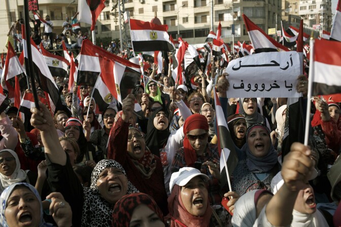 CAIRO, EGYPT - JULY 03: Egyptian opposition protesters celebrate as news is announced of Egyptian President Mohammed Morsi proposing a consensus government as a way out of the country's political crisis, at Egypt's Presidential Palace on July 3, 2013 in Cairo, Egypt. As the Egyptian Army's deadline passed on Wednesday afternoon, President Morsi proposed a consensus government as a way out of the country's political deadlock between the military and Muslim Brotherhood. As unrest spreads throughout the country, at least 23 people were killed in Cairo on Tuesday and over 200 others were injured. It has been reported that the military has taken over state television. (Photo by Ed Giles/Getty Images)