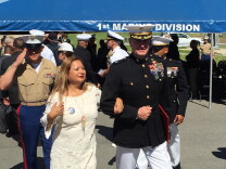 Rosa Peralta is escorted following a ceremony awarding her son Rafael the United States Marine Corps' second-highest valor award: the Navy Cross. Her son was killed in Iraq in November 2004.