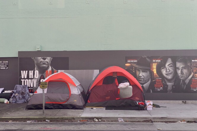 Two tents next to each other on a sidewalk in Hollywood