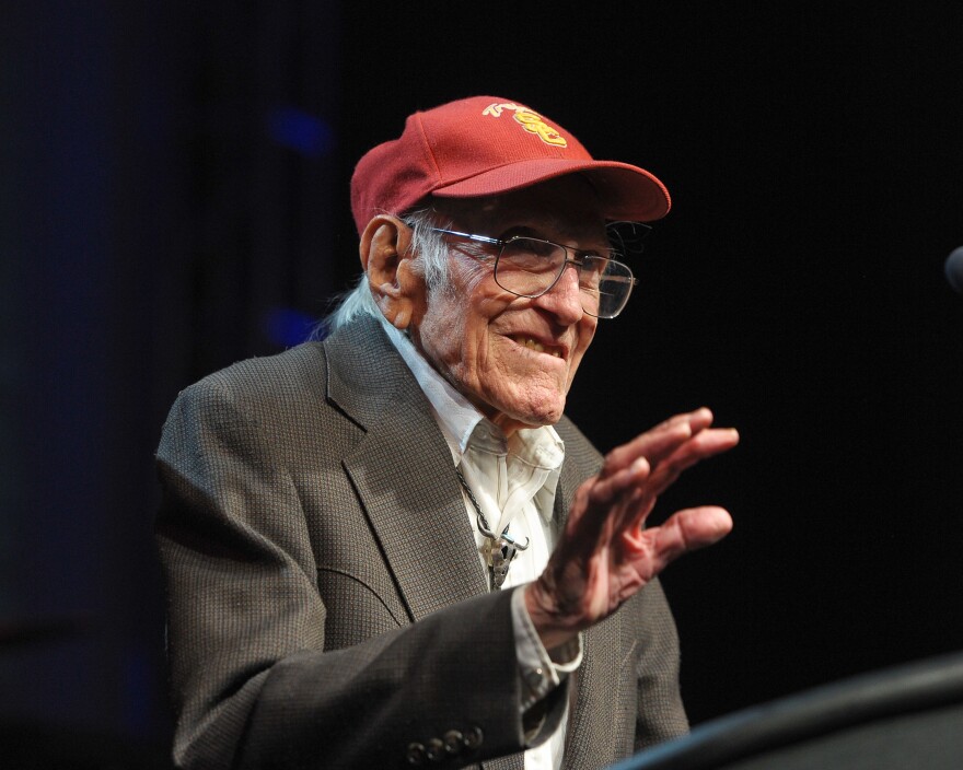 File: Louis Zamperini presents an award at the 2011 Golden Goggles at JW Marriott Los Angeles at L.A. LIVE on November 20, 2011 in Los Angeles.