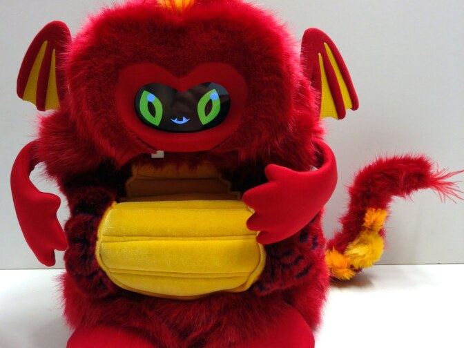 This dragonbot named Chili encourages students to make healthy food choices. The students give Chili different foods, and Chili gives feedback after tasting the foods.