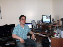 Quincy Surasmith surrounds his desk with five electronic screens at his apartment. He has a Mac desktop computer, a laptop, home theater PC, tablet and a smartphone. Networks are now marketing to people like Surasmith using social media and apps to create an interactive experience for viewers.