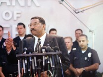 Los Angeles Police Chief Willie Williams answers reporters questions during a news conference in front of the bullet scarred Bank of America in the North Hollywood section of the city in Los Angeles on Saturday, March 1, 1997, following a wild shootout through local streets that started as the bank was being robbed. Williams was the first African-American police chief in both Philadelphia and Los Angeles. He took over from LAPD Chief Daryl Gates following the 1992 riots.
