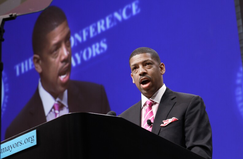 Sacramento, Calif., Mayor Kevin Johnson, president of the U.S. Conference of Mayors, speaks before a panel discussion about sports and race relations during a conference meeting Monday, June 23, 2014, in Dallas. (AP Photo/LM Otero)