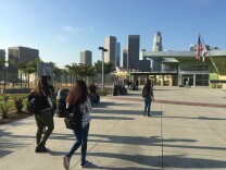 High school students walk toward the gates of the L.A. Unified School District's Roybal Learning Center on Tues., Aug. 14, 2018.