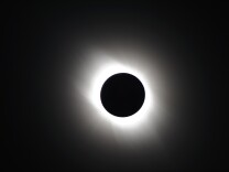 In this handout image provided by National Astronomical Observatory of Japan, the solar eclipse is seen on July 22, 2009 near Iwojima Island, Tokyo, Japan. The longest total eclipse of the sun of this century triggered tourist fever in Asia as astronomy enthusiasts from home and abroad flocked to watch the event The eclipse was visible from within a narrow corridor that begins in India and crosses through Nepal, Bangladesh, Bhutan, Myanmar and China.