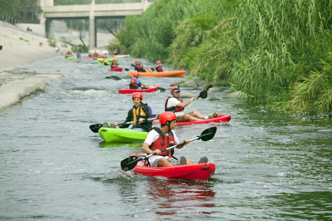 Kayakers paddle the L.A. River on June 1, 2013 during a tour led by George Wolfe and L.A. River Expeditions. On Memorial Day, the Los Angeles River Pilot Recreational Zone, a 2.5 mile stretch of the river, officially opened to the public for kayaking, walking, birdwatching and fishing.