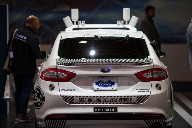 An experimental Ford Fusion self-driving delivery car is displayed at CES in Las Vegas, Nevada, January 12, 2018. / AFP PHOTO / DAVID MCNEW        (Photo credit should read DAVID MCNEW/AFP/Getty Images)