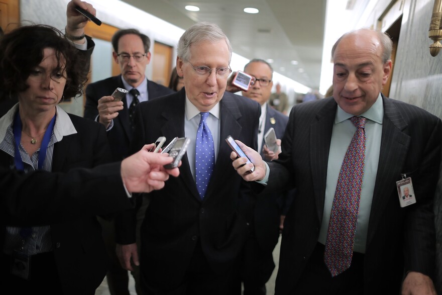 WASHINGTON, DC - NOVEMBER 30:  Senate Majority Leader Mitch McConnell (R-KY) talks with reporters after leaving a tax reform news conference in the Dirksen Senate Office Building on Capitol Hill November 30, 2017 in Washington, DC. McConnell and Senate Republicans hope to pass sweeping tax cuts sometime Thursday or Friday.  (Photo by Chip Somodevilla/Getty Images)