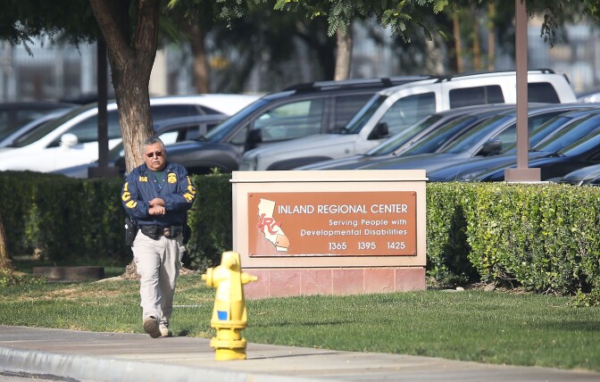 SAN BERNARDINO, CA - DECEMBER 04:  An I.C.E. agent walks near the Inland Regional Center on December 4, 2015 in San Bernardino, California. Law enforcement officials continue to investigate the mass shooting at the Center that left 14 people dead and another 17 injured on December 2.  (Photo by Joe Raedle/Getty Images)